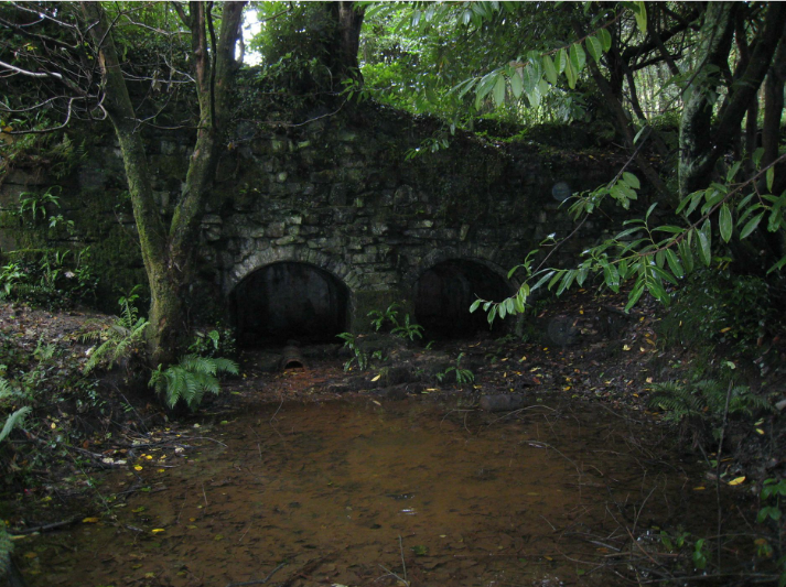 Hydropower installation and restoration of Penllergare Valley Woods Decorative stone arches containing drain down pipes for the lake
